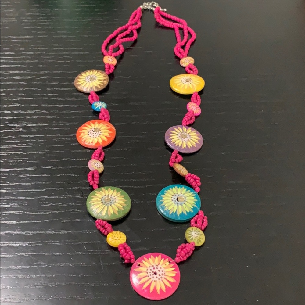 Necklace made of pink beads and colorful flowers